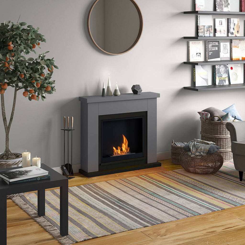 Living room with a fireplace, shelves, and decorative items.
