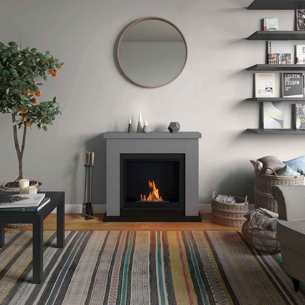 Living room with a fireplace, shelves, and decorative items.