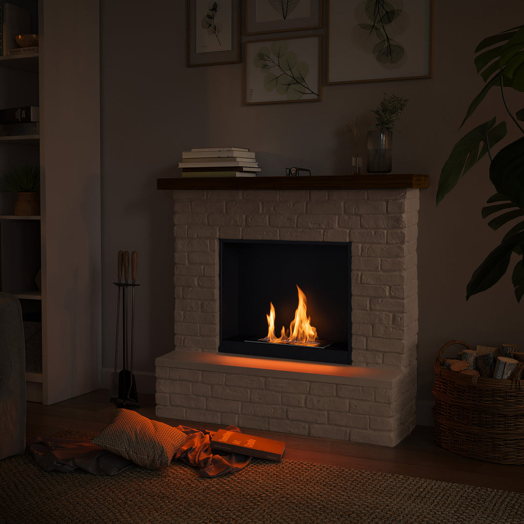 Cozy living room with a lit fireplace, books, and decorative items.